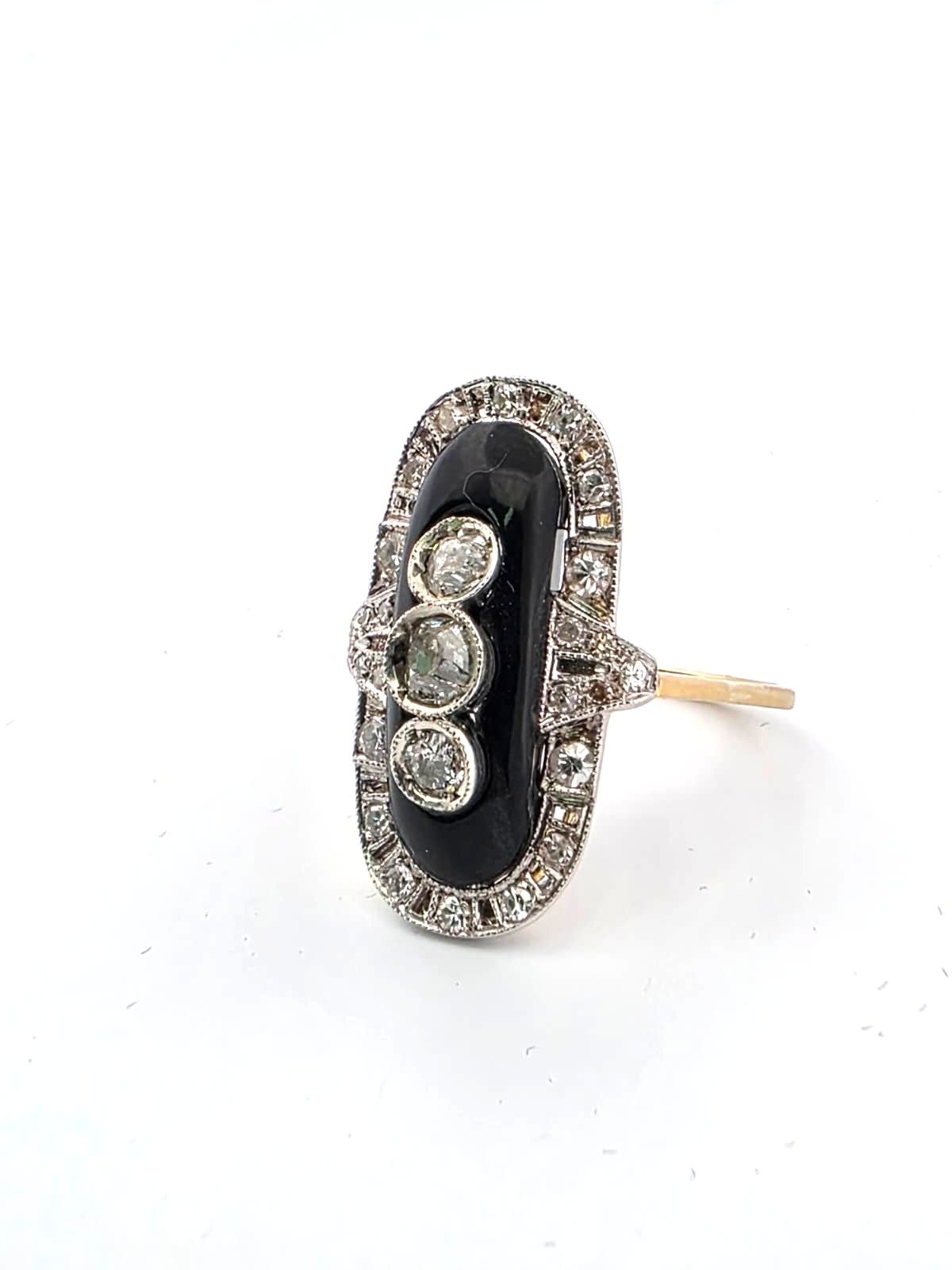 Anello in oro giallo 18kt e platino con onice e diamanti